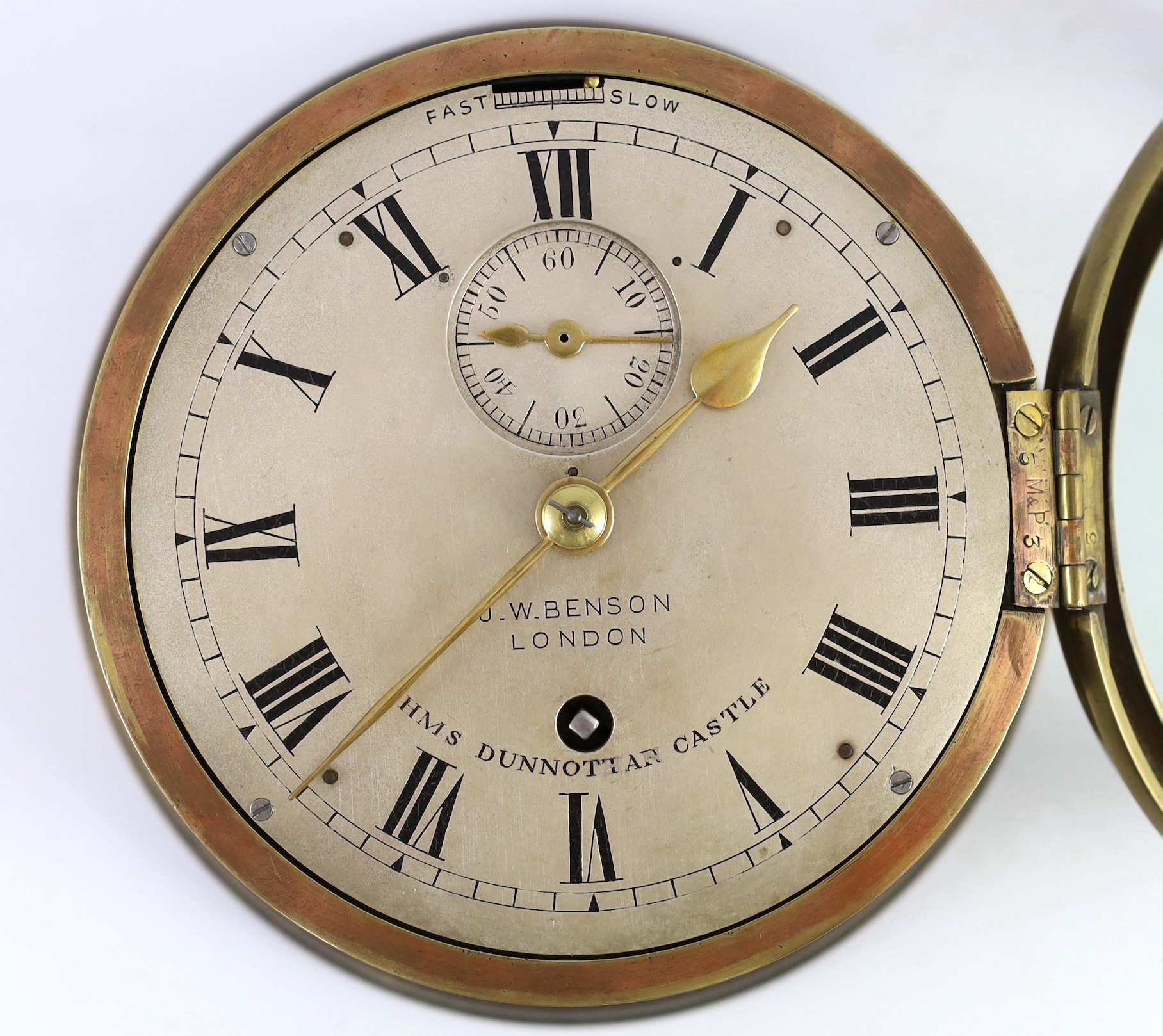 J.W. Benson of London. A brass bulkhead timepiece for HMS Dunnottar Castle, 22cm diameter